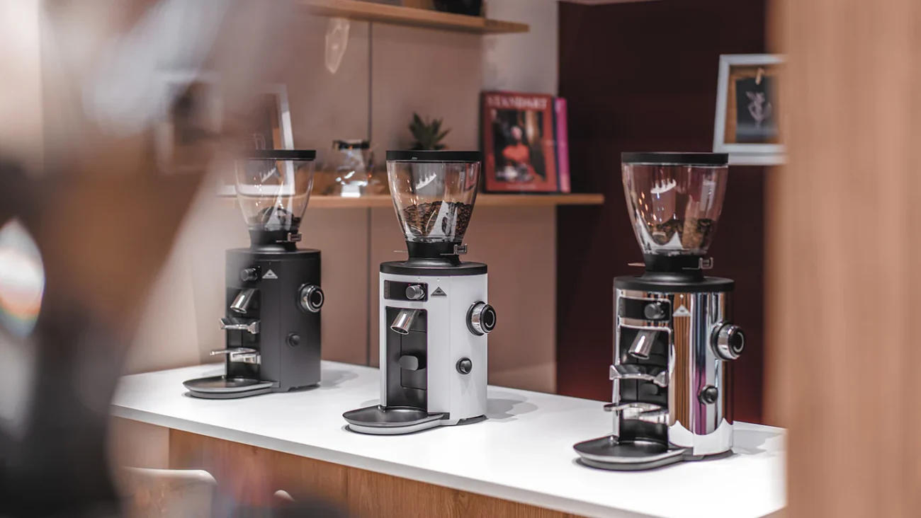 Professional commercial coffee grinders displayed in a coffee shop
